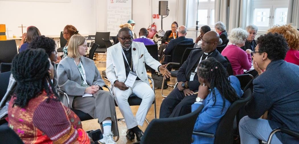 Clergy and leaders in a group discussion